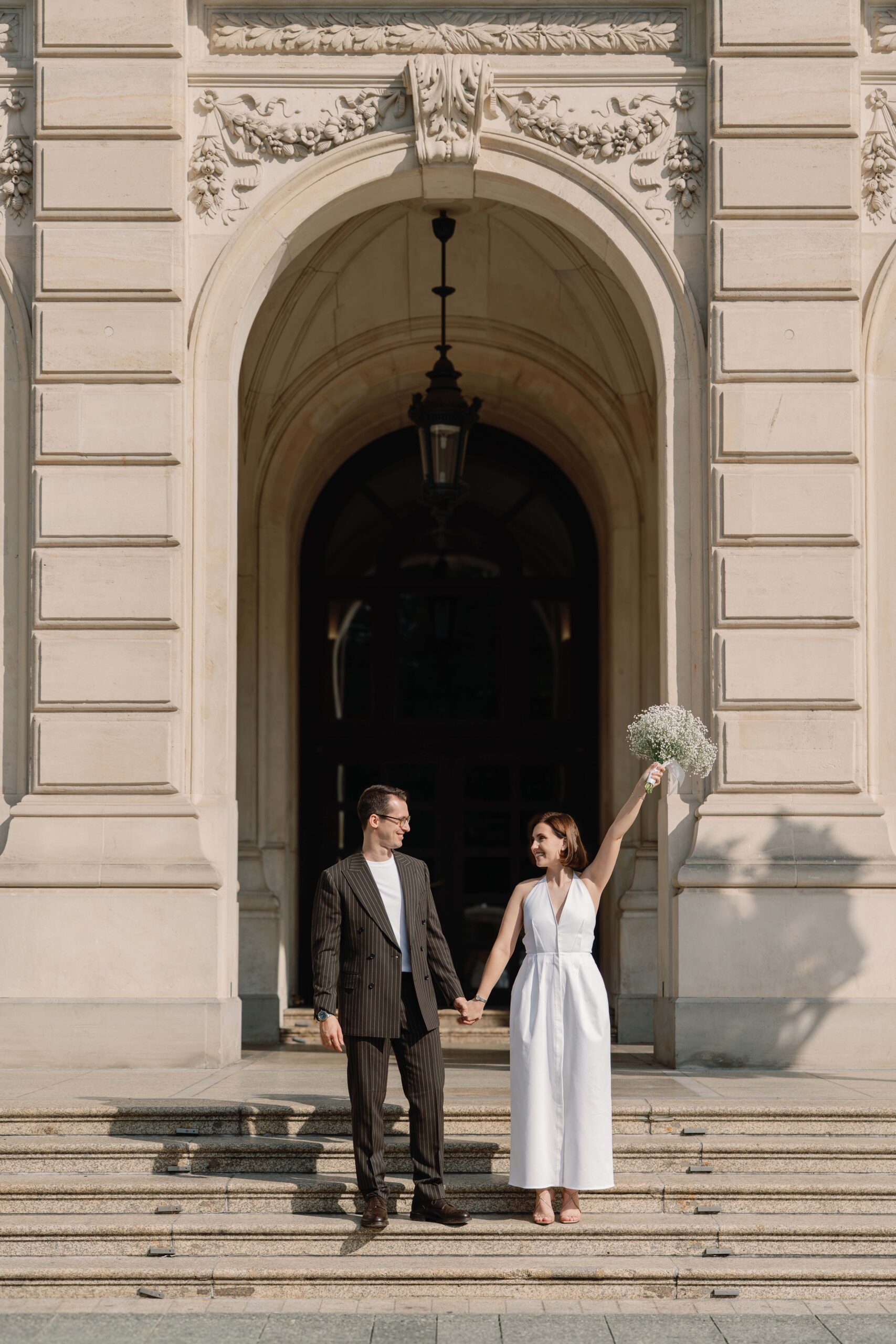 Civil wedding couple walking through Frankfurt streets